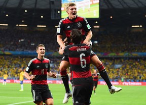 Toni Kroos of Germany celebrates scoring his team's fourth goal with teammates Miroslav Klose, left, and Sami Khedira during the World Cup Brazil semifinal match between Brazil and Germany at Estadio Mineirao on July 8, 2014 in Belo Horizonte, Brazil.  (Photo by Buda Mendes/Getty Images)