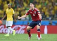 Colombia midfielder James Rodriguez celebrates scoring a penlaty during the quarter-final match between Brazil and Colombia on July 4, 2014. (Vanderlei Almeida/AFP/Getty Images)