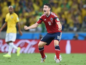 Colombia midfielder James Rodriguez celebrates scoring a penlaty during the quarter-final match between Brazil and Colombia on July 4, 2014. (Vanderlei Almeida/AFP/Getty Images)