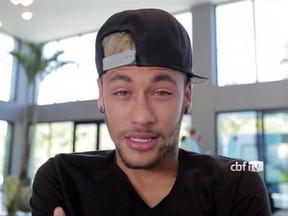 Handout TV image released by the Brazilian football Confederation of Brazil's star striker Neymar crying as he addresses the Brazilian fans before his departure for his home in Guaruya, at Granja Comary training center in Teresopolis, Rio de Janeiro state, Brazil, on July 5, 2014.  Injured Brazil star Neymar departed his team's training base in Terespolis in a helicopter on Saturday and headed home to Sao Paulo, after his World Cup ended in agony on Friday night.