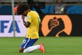 Brazil's midfielder Willian reacts at the end of the semifinal football match between Brazil and Germany at The Mineirao stadium in Belo Horizonte during the 2014 FIFA World Cup on July 8, 2014. Germany won 7-1.  
AFP PHOTO / VANDERLEI ALMEIDA/AFP/Getty Images