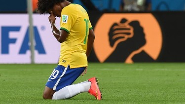 Brazil's midfielder Willian reacts at the end of the semifinal football match between Brazil and Germany at The Mineirao stadium in Belo Horizonte during the 2014 FIFA World Cup on July 8, 2014. Germany won 7-1.  
AFP PHOTO / VANDERLEI ALMEIDA/AFP/Getty Images