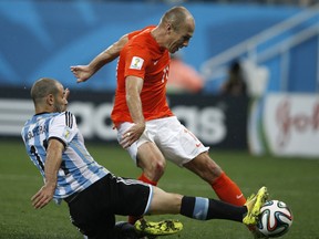 The moment when midfielder Javier Mascherano tore his anus during the semi-final football match between Netherlands and Argentina of the FIFA World Cup at The Corinthians Arena in Sao Paulo on July 9, 2014.