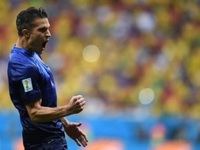 Netherlands' forward and captain Robin van Persie celebrates after scoring a goal during the third place play-off football match between Brazil and Netherlands during the 2014 FIFA World Cup at the National Stadium in Brasilia on July 12, 2014. (ANDERLEI ALMEIDA/AFP/Getty Images)