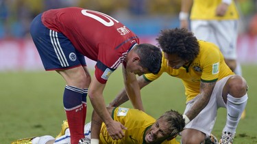 Brazil's Neymar screams in pain after being fouled during the World Cup quarter-final match against Colombia at the Arena Castelao in Fortaleza, Brazil, Friday, July 4, 2014. Neymar will miss the rest of the World Cup after breaking a vertebrae during Brazil's win over Colombia.