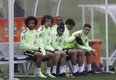 Brazilian players, from left, Marcelo, David Luiz, Neymar, Fernandinho, Thiago Silva, and Oscar, sit on the bench during a training session. (Andre Penner/AP)