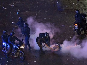 Argentine fans clash with the police after celebrations for the performance of the national team in the FIFA World Cup Brazil 2014 final at the Obelisk in Buenos Aires on July 13, 2014. (DANIEL GARCIA/AFP/Getty Images)