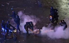 Argentine fans clash with the police after celebrations for the performance of the national team in the FIFA World Cup Brazil 2014 final at the Obelisk in Buenos Aires on July 13, 2014. (DANIEL GARCIA/AFP/Getty Images)