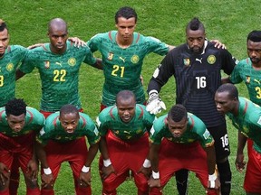 Cameroon's national team (back L-R) Cameroon's forward Eric Maxim Choupo-Moting, Cameroon's defender Allan Nyom, Cameroon's midfielder Joel Matip, Cameroon's goalkeeper Charles Itandje and Cameroon's defender Nicolas Nkoulou  (front L-R) Cameroon's midfielder Stephane Mbia, Cameroon's midfielder Alexandre Song, Cameroon's midfielder Jean Makoun, Cameroon's midfielder Landry N'Guemo, Cameroon's defender Henri Bedimo and Cameroon's forward Vincent Aboubakar pose for a team photo prior to the Group A football match between Cameroon and Brazil at the Mane Garrincha National Stadium in Brasilia during the 2014 FIFA World Cup on June 23, 2014.  AFP PHOTO / EVARISTO SAEVARISTO SA/AFP/Getty Images