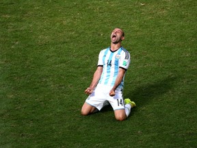 Javier Mascherano of Argentina celebrates after defeating Belgium 1-0. (Jamie Squire/Getty Images)