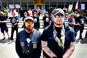 Beau Welling, left, and Greg Paul belong to an Alberta chapter of the armed militia group Three Percenters.