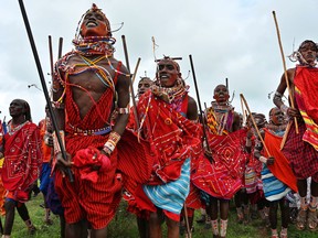 Kenyan Maasai Morans attend a sporting event dubbed the Maasai Olympics at Kimana, near Kenya’s border town with Tanzania