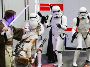 Star Wars fans engage in cosplay at the Calgary Comic and Entertainment Expo