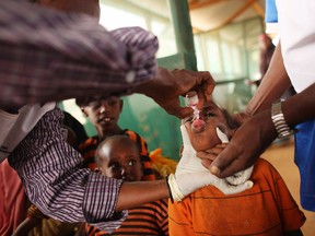 A young child is given a vaccine by Medecins Sans Frontieres in the Dagahaley refugee camp.