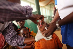 A young child is given a vaccine by Medecins Sans Frontieres in the Dagahaley refugee camp.