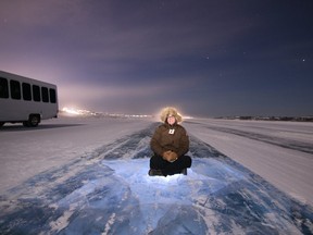 Jennifer Bain marvels at the night sky on the Yellowknife to Dettah ice road. Photo: North Star Adventures.