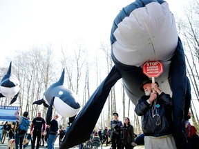 Members of the Canadian Orca Rescue Society and others demonstrate