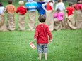 A little boy celebrates Canada Day at Heritage Park in Calgary