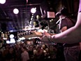 A band plays at a honky tonk in Nashville