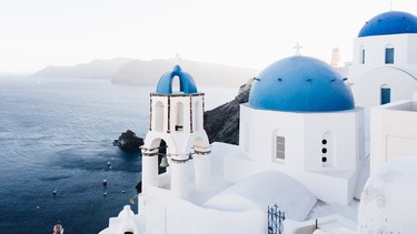 Santorini, Greece, with its whitewashed churches with blue domes.