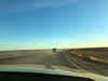 Trucks driving along the highway to Tuktoyaktuk, NWT