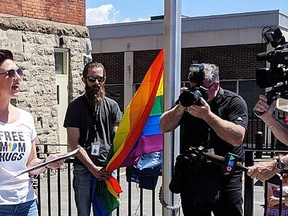 Sophie Smith-Doré and her son Ethan, an LGBTQ+ youth, appear at the ceremony raising the Pride flag at Arnprior, Ont., city hall