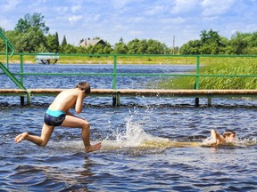 kids swimming in a lake