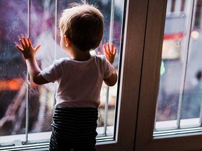 Toddler by the window