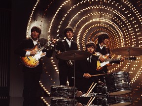 The Beatles perform Rain and Paperback Writer on the BBC TV show Top of the Pops in June 1966.