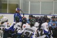 Lisa Haley coaches the female hockey players on Hit the Ice. APTN