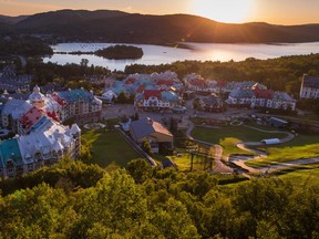 Quebec's Laurentian Highlands, in the fall, offers gorgeous leaf-peeping, resort deals, and fewer crowds. Pictured: Tremblant resort's Pedestrian Village beside Lac-Tremblant
