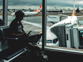 Smartphone traveller at the airport