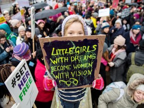 Orla Dean, 5, holds a placard during a Time’s Up rally in London, England.