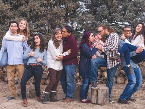 Family members posing together in the forest