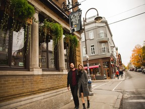 A couple walks the streets of St. Roch