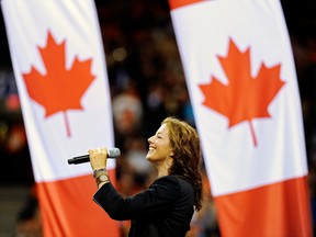 Sarah McLaughlin is shown performing O Canada at a CFL game. In 2018, Parliament approved a change to Canada’s national anthem. “In all thy sons command” became “in all of us command” — which sparked some controversy.