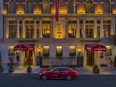 The grand facade (and hotel car) at dusk