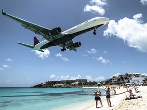 Airliner over a beach