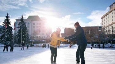 couple ice skating outdoors