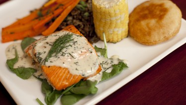 Salmon and corn on a white plate