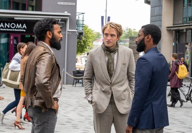 From left, Himesh Patel, Robert Pattinson and John David Washington in a scene from Tenet.