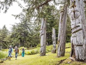 Ancient poles stand after hundreds of years, rimming the Haida village of SGung Gwaay Llnagaay in Gwaii Haanas National Park Reserve and Haida Heritage Site.
