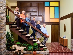 The original Brady Bunch cast (Susan Olsen, left, Mike Lookinland, Eve Plumb, Christopher Knight, Maureen McCormick and Barry Williams) re-create the iconic Brady family portrait at the recently renovated Brady home in Studio City, Calif.