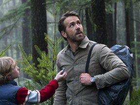 Walker Scobell, left, with Ryan Reynolds — who was amazed to find just the right young actor.