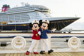 Minnie and Mickey Mouse are welcoming passengers onto the Disney Wish in Port Canaveral, Fla.