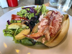 The lobster roll at the Lobster Barn Pub and Eatery in Victoria By the Sea might just be the best lobster roll I've ever had. lobster roll at the Lobster Barn in Victoria by the Sea.