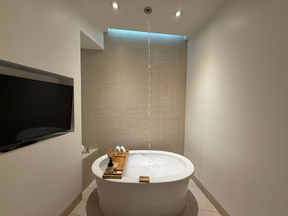 The bathtub, that fills up with water from the ceiling.