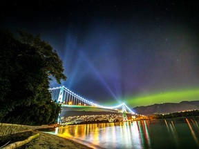 Aurora (Northern Lights) with lights of Lions Gate Bridge, Vancouver, BC, Canada