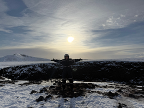 Stopping by a crater while on a snowmobile tour in Myvatn.