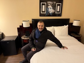 Jordan Friedman of ToursbyLocals in room 305 of the historic Washington Square Hotel in Greenwich Village, where Bob Dylan stayed with Joan Baez. Guests still request the room, despite the brick wall view.